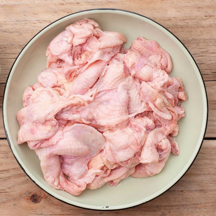 Raw chicken skin on white background